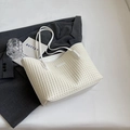 White woven texture tote bag for women with dual shoulder straps on a grey blazer - Off-white