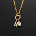 Gold stainless steel necklace with letter U charm and round crystal pendant - Letter U