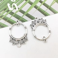 Silver swirl metal earring connectors with vintage filigree design on a white background - Swirl Round 23x34mm