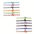 Detailed view of colorful dinosaur silicone wristbands for children in various patterns - Three-hole Bracelet