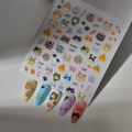 Cute cat themed nail stickers with paw prints and ice cream patterns in macaque colors - Chibi Cat Style (CO-350)