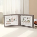 Rotating 4x6 double-sided wood texture photo frame in a warm natural light setting - Grey Wood - Horizontal / 6 Inch