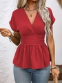 Detail of red V-neck top featuring pleated waist and elegant peplum hemline style - S / Red