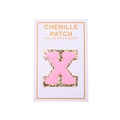 Close-up of pink chenille letter X patch with gold sequins and self-adhesive backing - Letter X