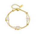 Bracciale a doppio strato in acciaio al titanio dorato con cuori in madreperla bianca - Oro