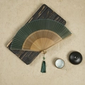 Classic dark green silk folding fan with bamboo hollowed-out frame and matching tassel - Dark Green / 23CM
