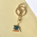Doctoral cap keychain with graduation cap, books and scroll on warm yellow background - Style 5 (Lobster Clasp)