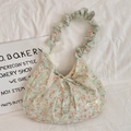 Macro detail of floral tote bag with pleated straps and delicate lace bow decoration - Orange Floral