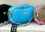 Three stylish crossbody camera bags in black, bright blue, and beige with unique straps - Sky Blue