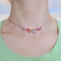 Detail of rose gold necklace with pink and light purple gems on a female model neck - Short Candy Necklace (Adjustable)