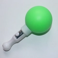Handheld green sphere glow stick with white handle and functional power switch button - Round Sand Ball Wand Green