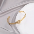 Golden stainless steel C-shaped open bracelet with sunburst star and translucent stone - Translucent Starburst (B01997-15)