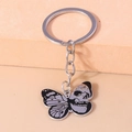Detail of gothic skeleton butterfly keychain with black enamel zinc alloy finish - Skull Textured Butterfly