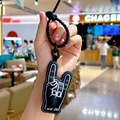 Cartoon black leather rock gesture keychain with white stitching and pink nail details - Black Charm-Rock On Gesture