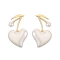 Close-up of elegant cherry-shaped copper earrings with gold leaves and white pearl hearts - Gold Large Heart Cherry