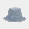 Close-up of frayed edge detail on a light blue washed denim bucket hat for women - M / Light Blue