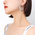 French style twisted hollow hoop earring in silver finish worn by a model - Medium Version / Steel