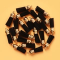 Bulk black tassel pendants with gold metal caps for DIY jewelry and bag accessories - Black