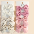 Detail showing eight-piece set of striped and polka dot hair clips on white cardboards - Style 5 (White/Pink Polka Dot)