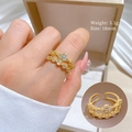 Detail view of adjustable gold four-leaf clover ring with sparkling zircon inlays - Adjustable Open / Gold