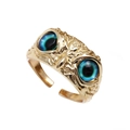 Gold owl-eye open ring with blue-green gradient stones on a clean white background - Adjustable Open / Blue