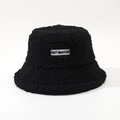 Detail of black faux shearling bucket hat featuring embroidered letter logo patch - M (56-58cm) / Black