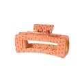Detail view of large rectangular hair claw clip with orange geometric hemp leaf pattern - Orange Pattern