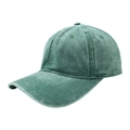 Close-up of vintage washed green cotton baseball cap showing stitching and fabric texture - Green
