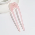 Detailed macro view of pink U-shaped hair pin with gold France Handmade engraving - Pink