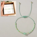 Perlenarmband in Geschenkbox mit minzgrünem gewebtem Seil und bunten Glasperlen - Dezember Geschenkbox Plus/Minzgrün