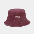 Detail of burgundy washed cotton bucket hat featuring white PARIS embroidery and vent holes - Burgundy