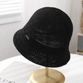 Detailed macro view of black breathable knitted bucket hat featuring a gold JSHAT logo - Black
