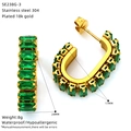 Detailed view of 18k gold plated stainless steel C-hoop earrings with green zircon gems - Green