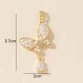 Detail of butterfly pendant with white pearls, diamonds and clear zircon drop charm - Gold Pearl Butterfly