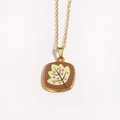 Macro shot of gold square pendant with brown enamel leaf and pink floral painting - Brown Background Green Leaf (Style 6)