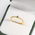 Close-up of 18k gold plated letter A adjustable ring with tiny diamonds in a velvet box - A Gold