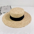 Detail of hand-woven raffia sun hat featuring a classic black ribbon and textured wide brim - M (56-58cm) Adjustable / Black Strap
