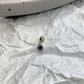 Detailed view of a purple heart zircon stud earring with silver beaded edge and screw ball back - Purple