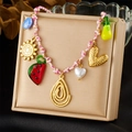 Collier bohème tissé coloré avec des breloques dorées en forme de soleil et coeur - Collier Tressé Multicolore Soleil Pastèque Poire Goutte (N3518)