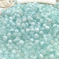 Macro detail of 10mm light blue cracked glass beads for DIY jewelry making - 8mm Semi-white Lake Blue