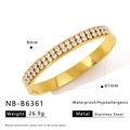 Detail of 18k gold-plated stainless steel bangle with dual row cubic zirconia inlay - Double Row Pave Wide Bangle (NB-B6361)