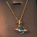 Golden planet necklace with blue nebula pendant, sparkling star and crescent moon accents - Gold - Octagonal Star Planet