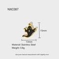 Detail view of a 15mm black enamel ghost charm pendant in stainless steel with gold edges - NXC087-Black Ghost