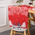 Detail showing red Christmas chair cover with cartoon gnomes and festive snowflake patterns - Red Faceless Gnome Chair Cover
