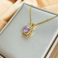 Close-up of gold pendant with central purple gem and zircon halo on satin backdrop - FZ007-Cushion Shape Purple Halo