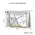 Macro shot of two-in-one waterproof PVC clear bag and marble PU cosmetic pouch set - X-152 Two-Piece Set Silver