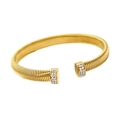 Macro detail of gold textured open bangle featuring sparkling pavé set cubic zirconia ends - 8mm Gold Open Bangle