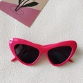 Retro rose pink cat-eye sunglasses with thick plastic frames and dark UV-protective lenses - Cat Eye / Dragon Whisker Red