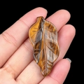 Tiger eye stone leaf carving with golden brown silk luster and detailed vein patterns - Tiger's Eye