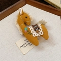 Detailed close-up of a mustard yellow horse brooch with floral embroidery and lace saddle - Ginger Yellow Cotton Linen Embroidery Horse Style (18#)